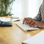 A nigerian lady working on Taxanchor360 a tool used for e-invoicing in Nigeria